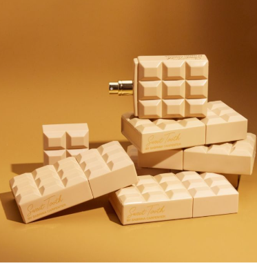 Caramel Dream Eau De Parfum 75ml spray bottle in caramel-colored chocolate bar design by Sabrina Carpenter - Fragrance Secrets  

